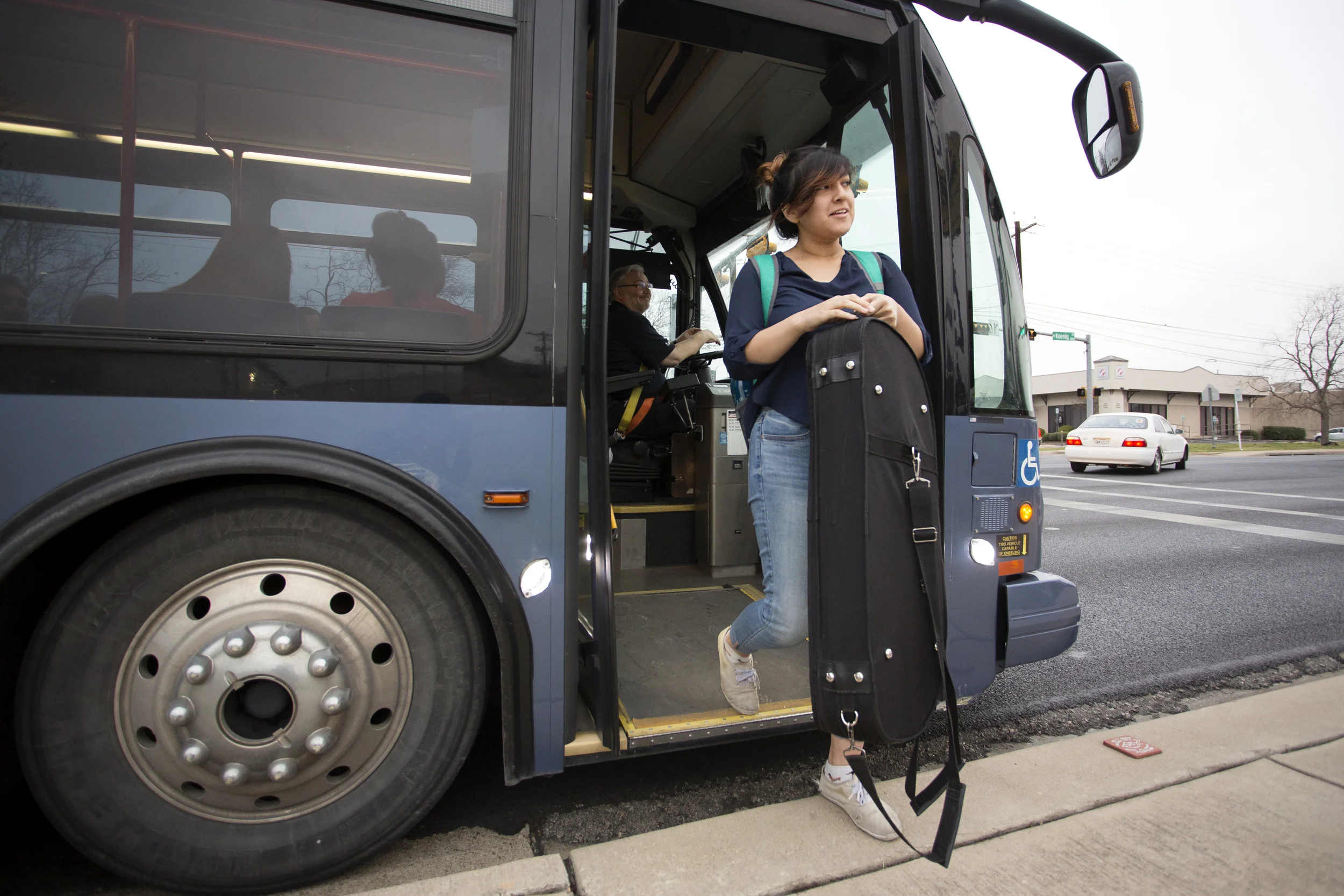 AUSTIN, TEXAS- Feb. 29, 2016. After a 40 minute commute, Violet Jimenez exits her bus at the intersection of E. Koenig Lane and Guadalupe Street. From here, Jimenez walks the remainder of her trip to McCallum High School. Miguel Gutierrez Jr. /KUT News.