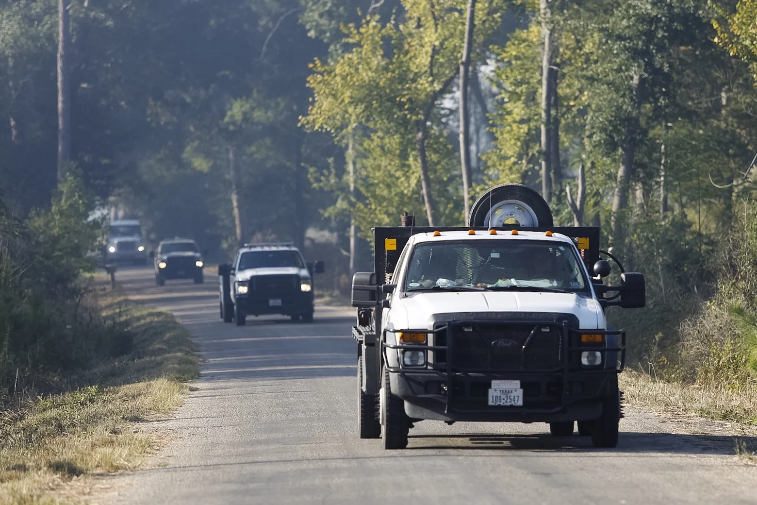SMITHVILLE, TEXAS - Oct. 15, 2015: Fire crews head towards a small fire near Alum Creek Road and Park Road 1C. Miguel Gutierrez Jr. /KUT News.