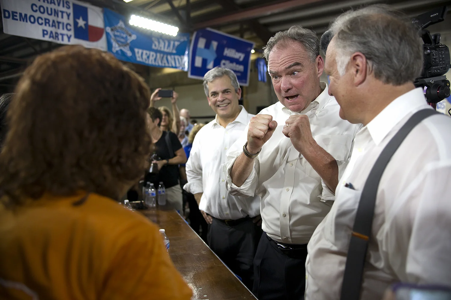 AUSTIN, TEXAS- August 9, 2016. Austin Mayor Steve Adler, Senator Tim Kaine, and Texas Senator Kirk Watson greet Democratic volunteers at an fundraising event in East Austin. Miguel Gutierrez Jr. /KUT News.