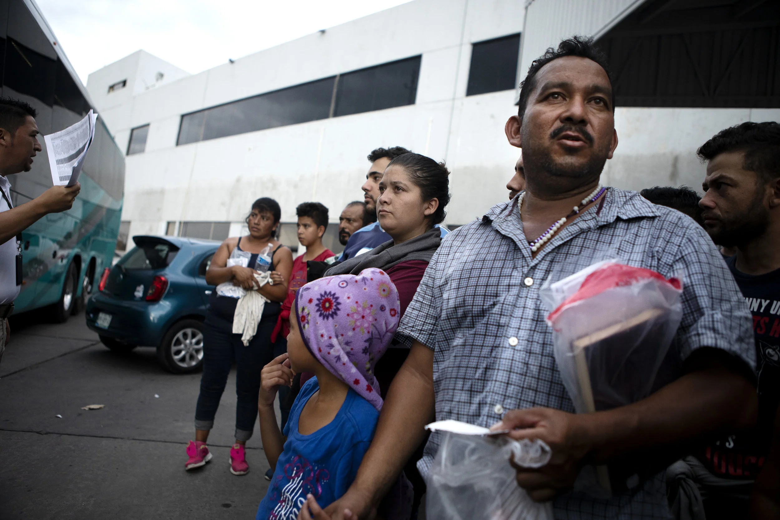 A group of migrants are processed at an immigration checkpoint in Nuevo Laredo. The group requested asylum in the United States, but were promptly returned to Mexico to await their court dates. July 22, 2019.