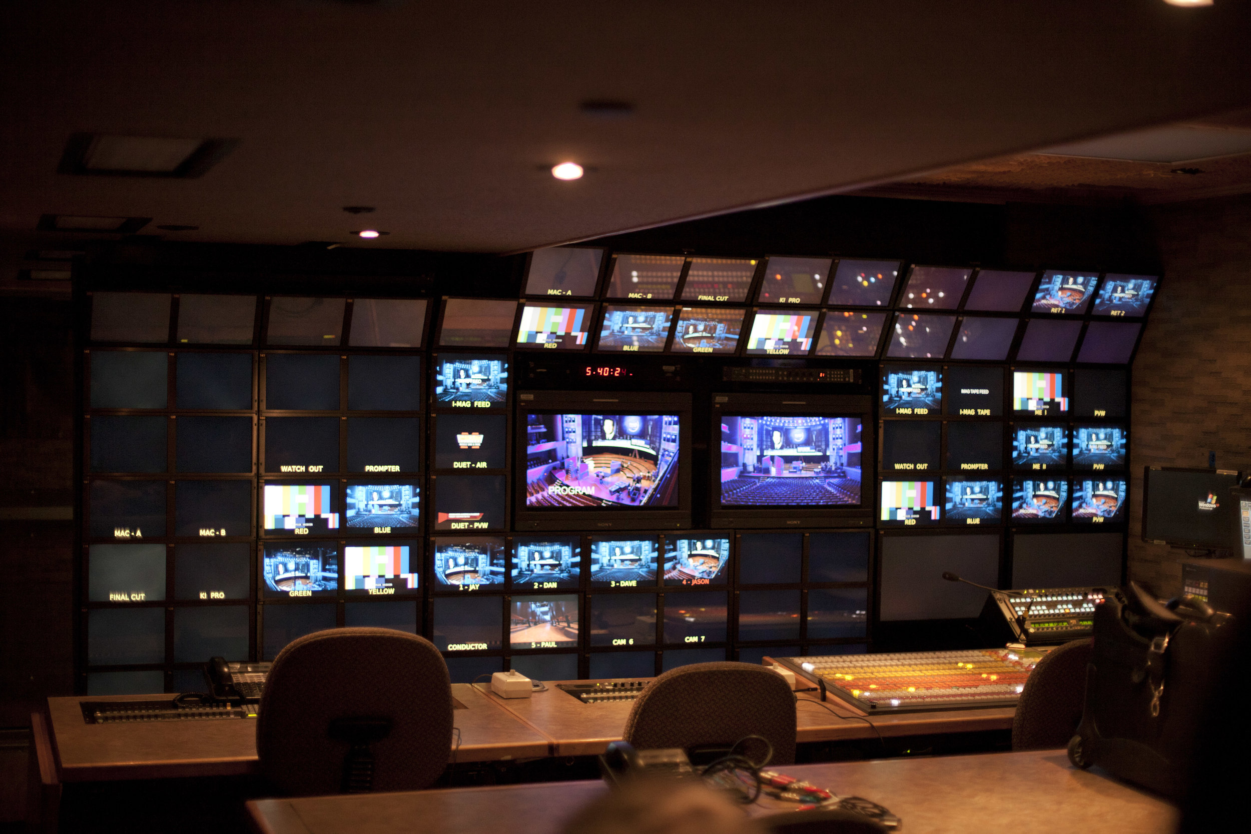 Control room with dozens of television screens