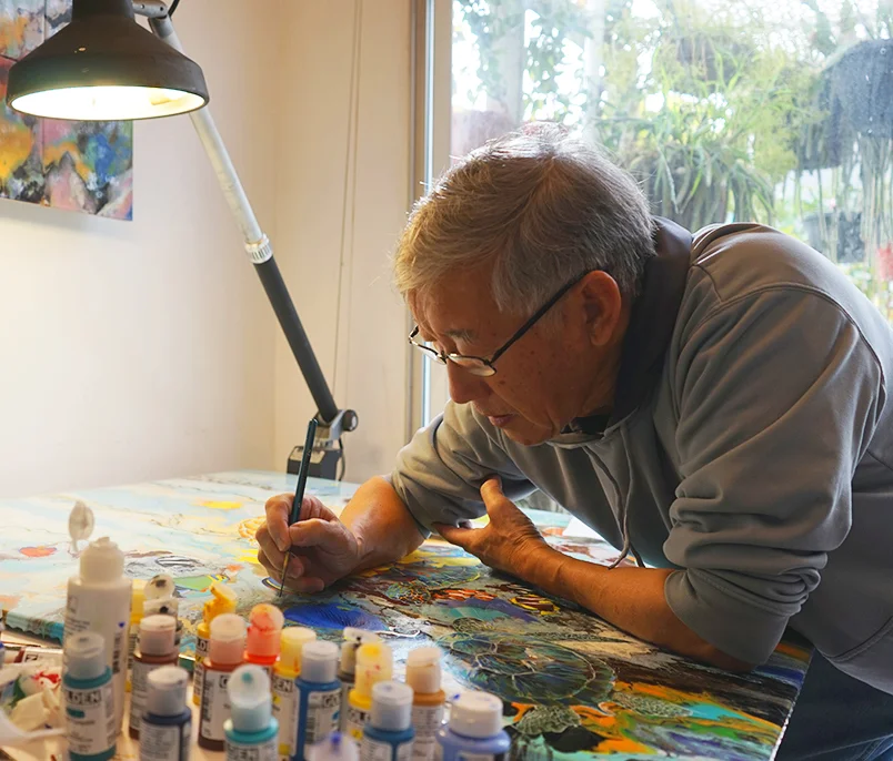 Giam painting "The Free Swimmers"
