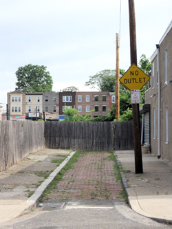 Poplar and Chang Streets, Philadelphia. Which is the better solution, the fence or the sign?
