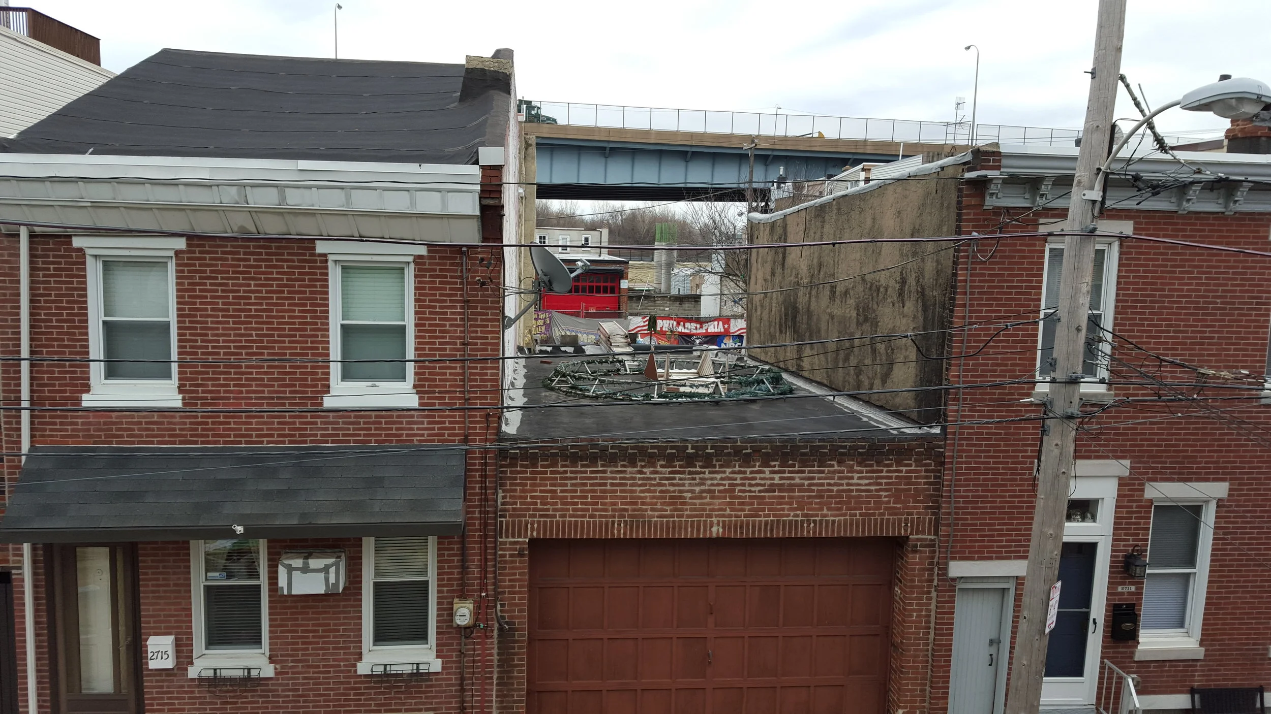 the view from the second-floor balcony; you can see the highway past the neighboring buildings