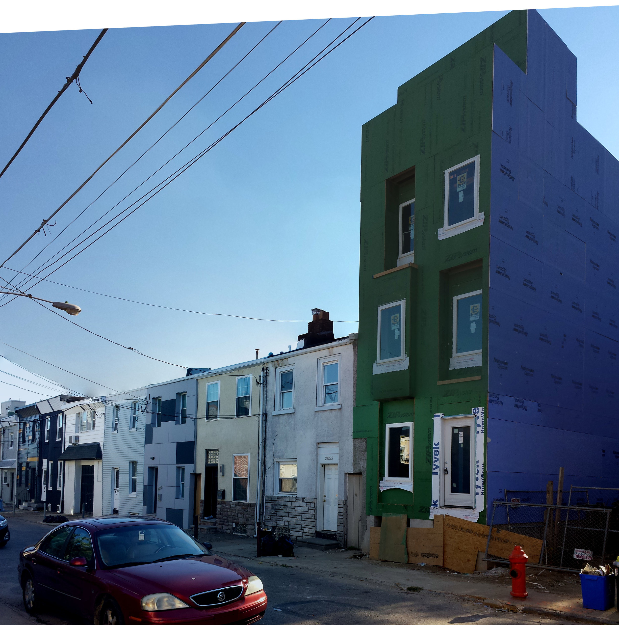 framing is finished; you can see the distinct height difference between this one and the neighbors. In the time since these photos were taken, new, similarly-scaled construction has taken place next door.