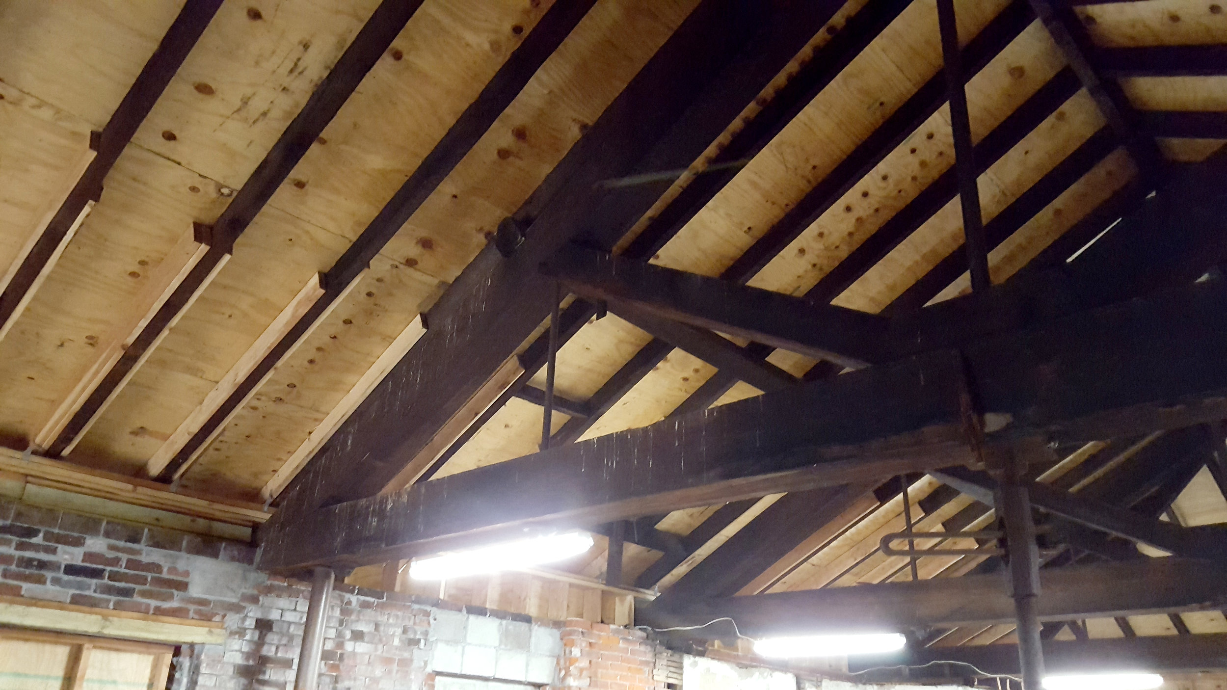 Carriages used to be stored in here; the large roof trusses also hold up the second floor, so that the first floor could be totally open. There's evidence that at one time there was an elevator (manually operated, of course) that could lift carriages up to the second level.