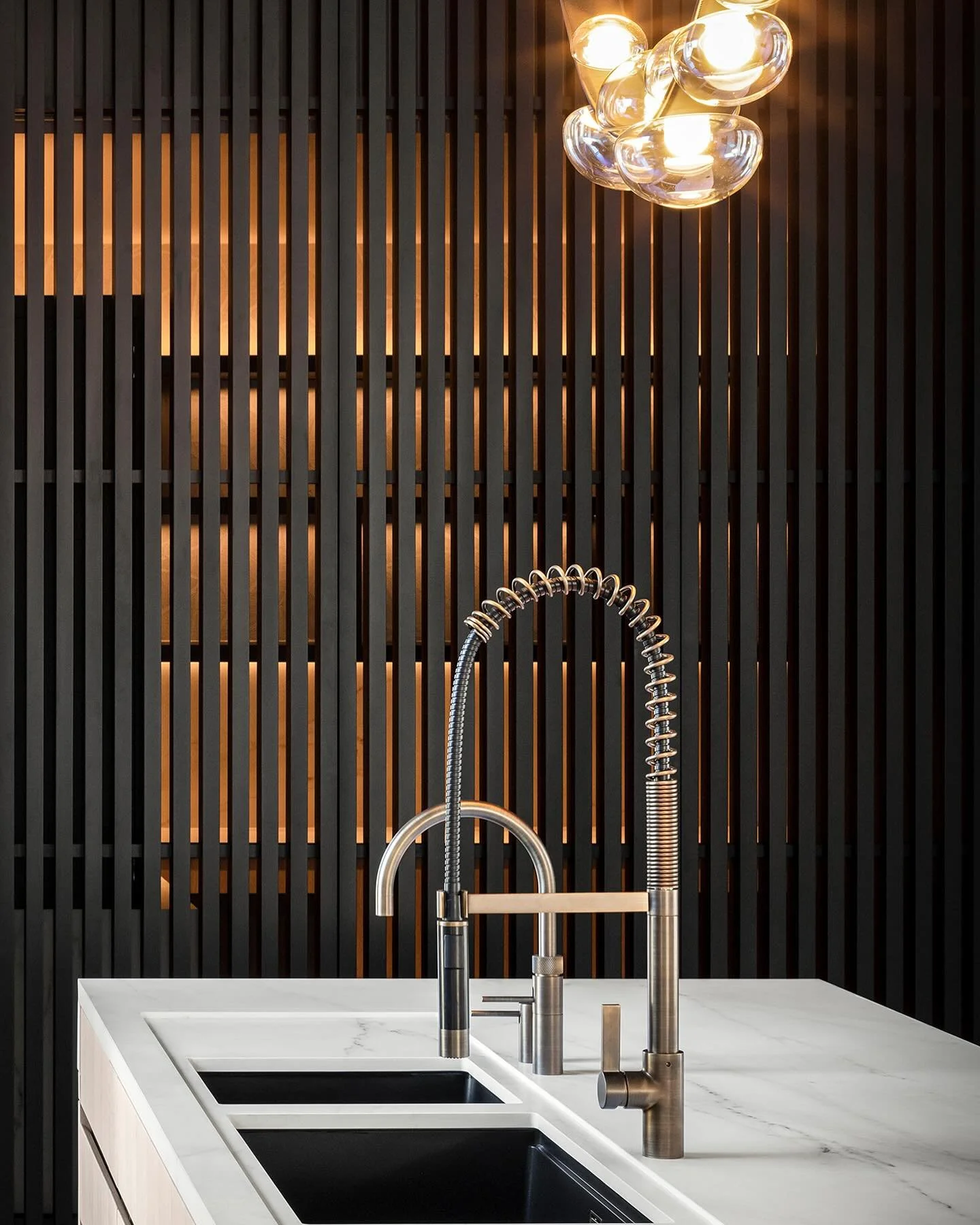 Our latest residential project in South Yorkshire has concealed linear light integrated into the pantry shelving visible through the slatted timber screen, balanced with the decorative pendant light above the kitchen island.
Lighting design @susanla