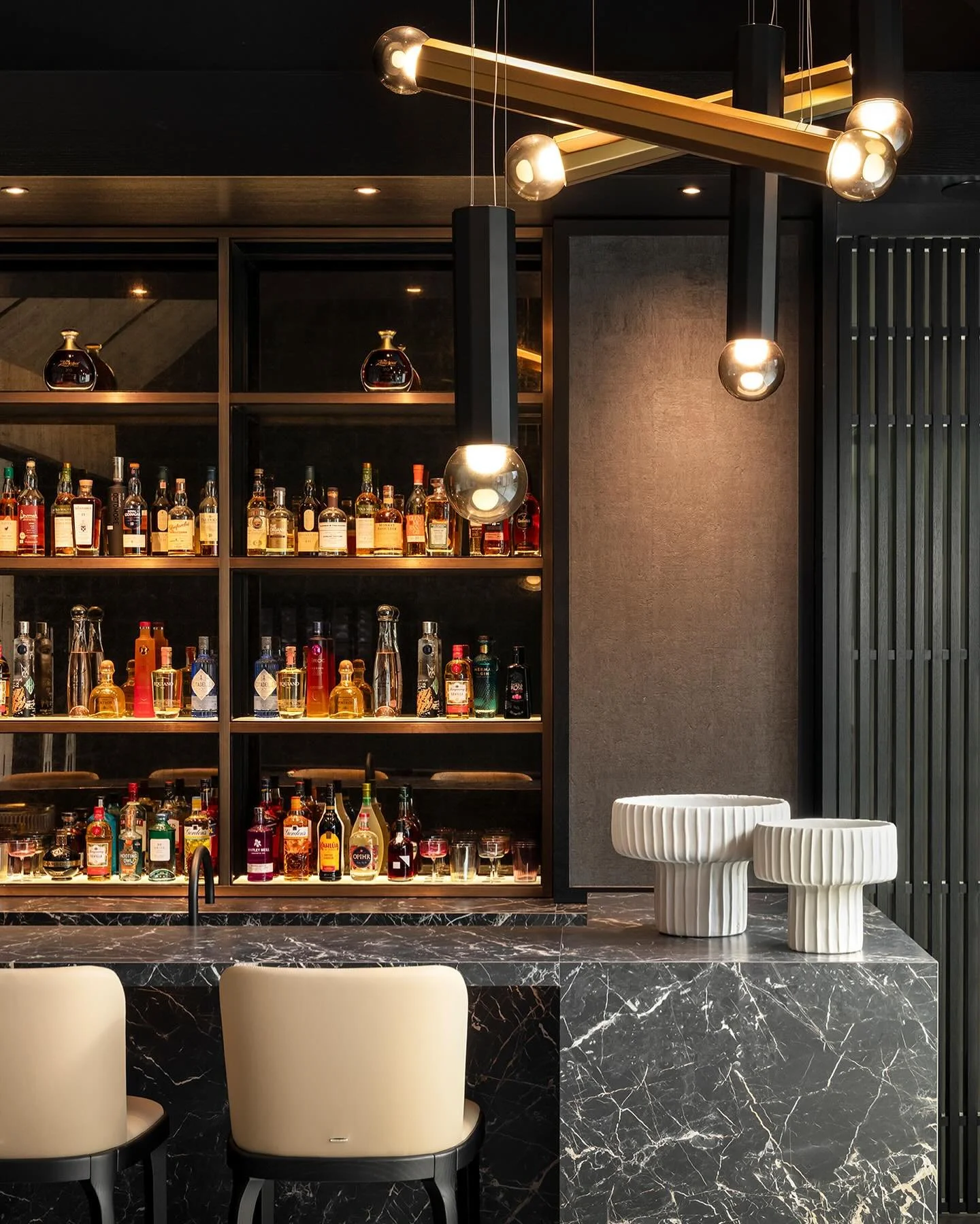 A detail shot of the entertainment suite, at our South Yorkshire residential project. We wanted the bottles to be brought to life and create a focal point, we achieved this by designing backlit glowing shelves in collaboration with Rachel Usher Inter