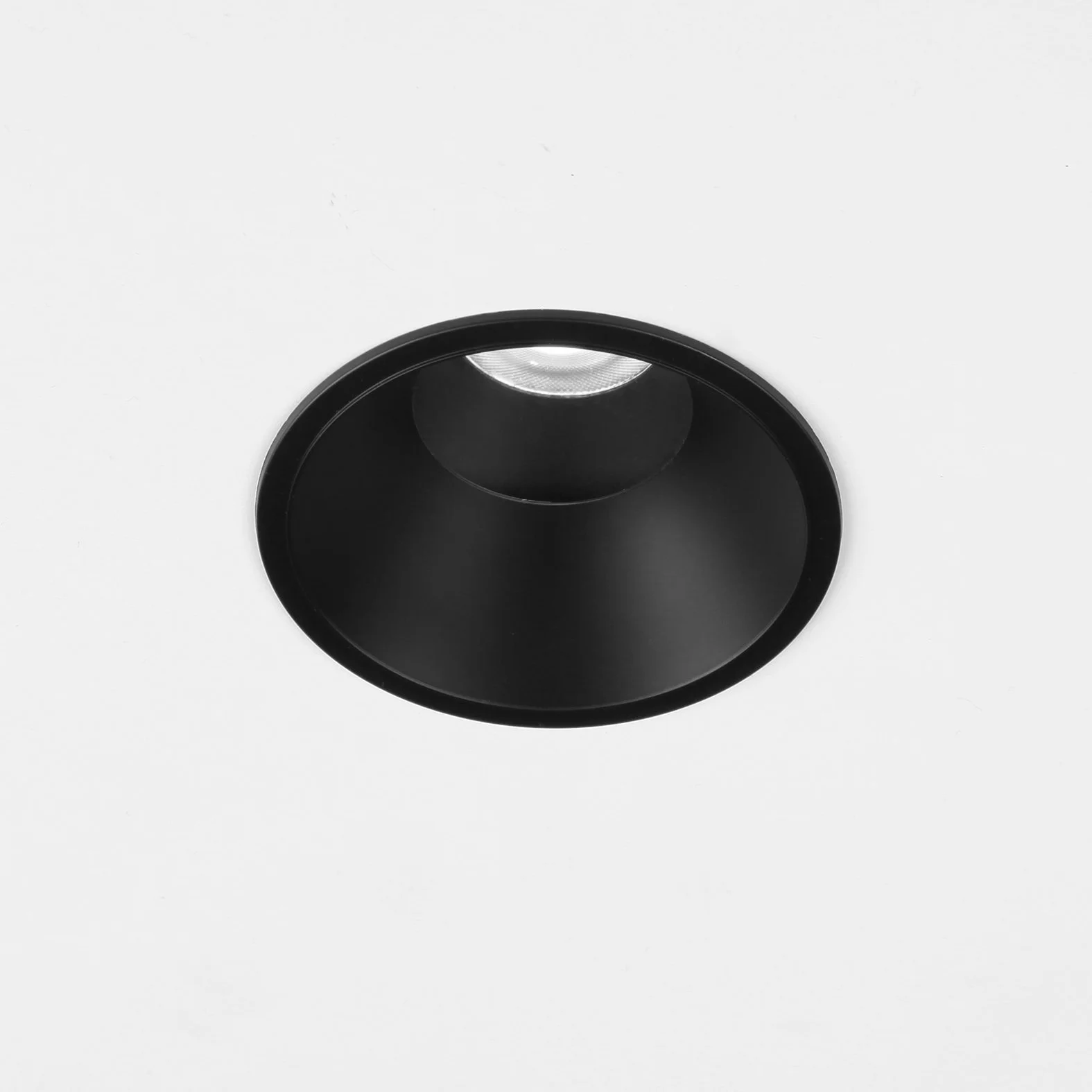 Black recessed ceiling light fixture on a white ceiling.