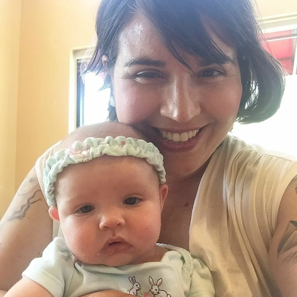 Tallulah and I on a mommy and me lunch date. She was about three months old.