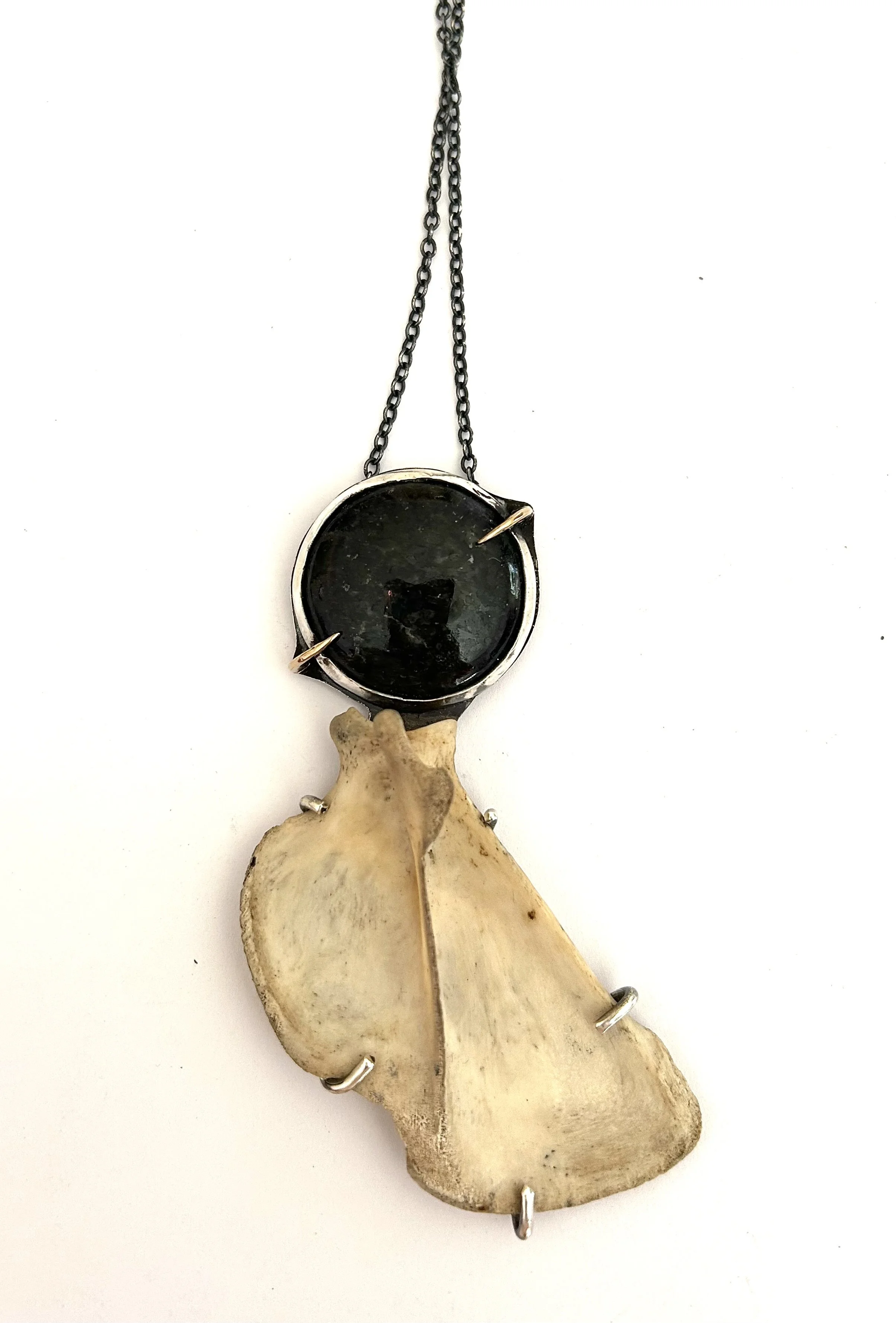 Scapula and gemstone pendant