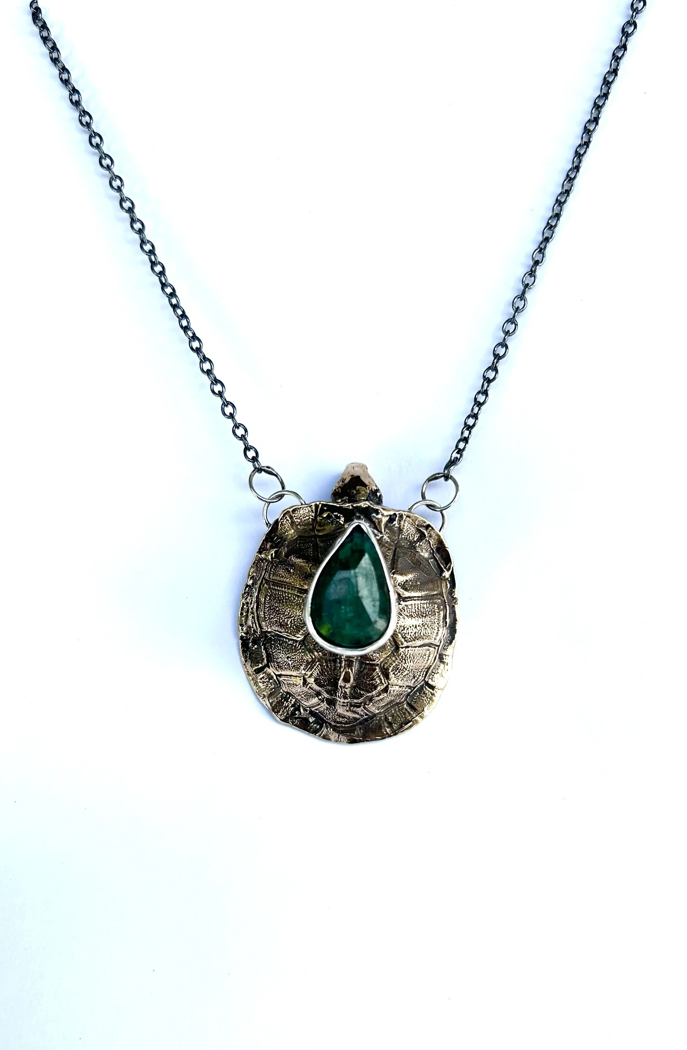 Keeper II turtle shell and emerald pendant