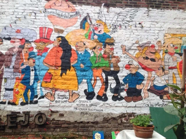 The mural outside on the ledge of the patio of El Kallejon in East Harle