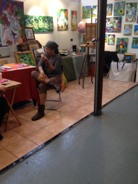 a vendor selling paintings in La Marqueta