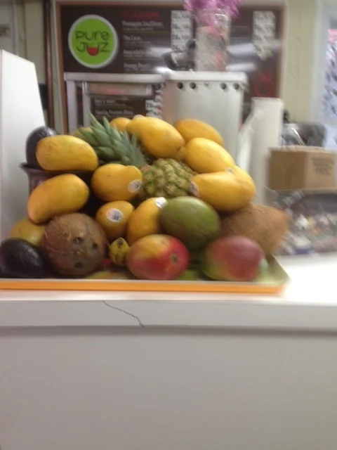 As a socially responsible business owner dedicated to building the local economy, Date purchases as much local produce as possible for Pure Juz shakes. (Probably not these pineapples and papayas!)