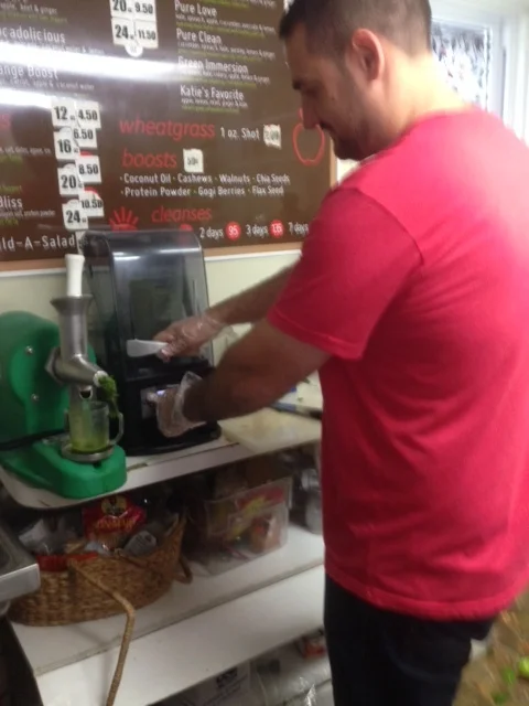 There's spinach, kale, almond butter and dates in the drink Dante whips up for me.