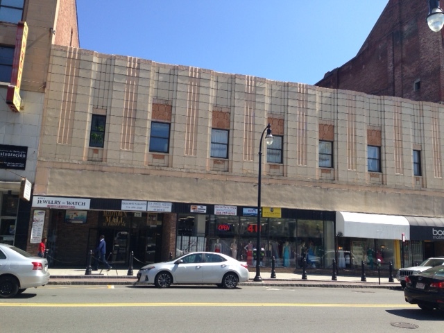 If one looks carefully at this photo, one will note several reasons why this building is pleasing and encourages active street life. The building entrance fronts right onto the sidewalk. Plenty of windows on each level of the building greet people on the street. The peachy tan color and little interesting architectural details on the façade make it pleasing to the eye. The building functions as a human scaled space, not an overpowering structure taking up a whole block. Ask yourself: Would you rather walk past this building or say, Medical City or the DCU Center on Major Taylor Boulevard? 