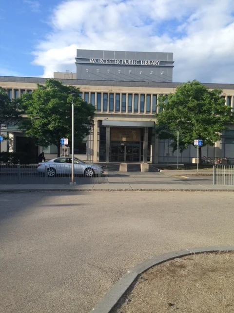 This is the view of the main entrance of the library that faces right onto the Francis McGrath parking lot. What is the message here? Drive, enter, do what you do, leave and drive away.