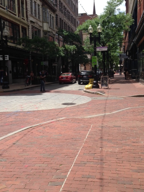 Here's some reasons why we wanted to walk: Check out the great brick lined sidewalks and streets! The white circle of bricks in the center of the street mark off the center of a two main streets. It's just pleasing for the eye. Each building is architecturally unique, historical, fronts up to the sidewalk. Notice the shady, mature street trees as well as the old fashioned light fixtures. There were so many small retail stores, restaurants, cafes, specialty shops, we were not sure what we would find turning the corner. Also, please note the short width of the streets that make room only for one traffic lane and one parking lane. 