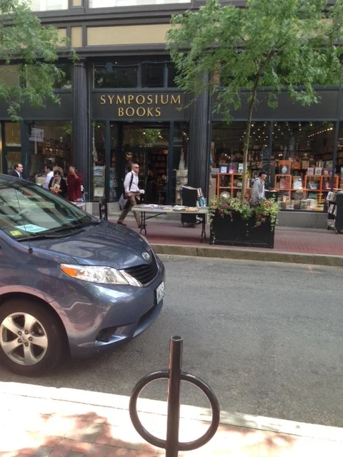Can you believe what we see? It's a real bookstore, not just another Barnes and Noble. There are tables of books out on the sidewalk to entice readers. 