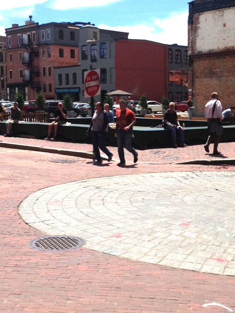 It looks like a building was taken down here. This was the only "empty lot" we saw on our walk. It seems as if part of the base of the structure has been kept? This area has become a pedestrian plaza and way station with many people sitting under the sun and eating lunch.