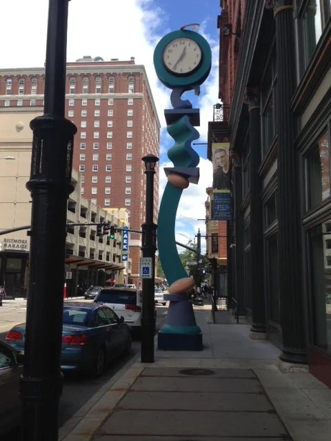 Check out this cool, artistic clock structure on the sidewalk. We passed by a building housing classrooms for the University of Rhode Island.