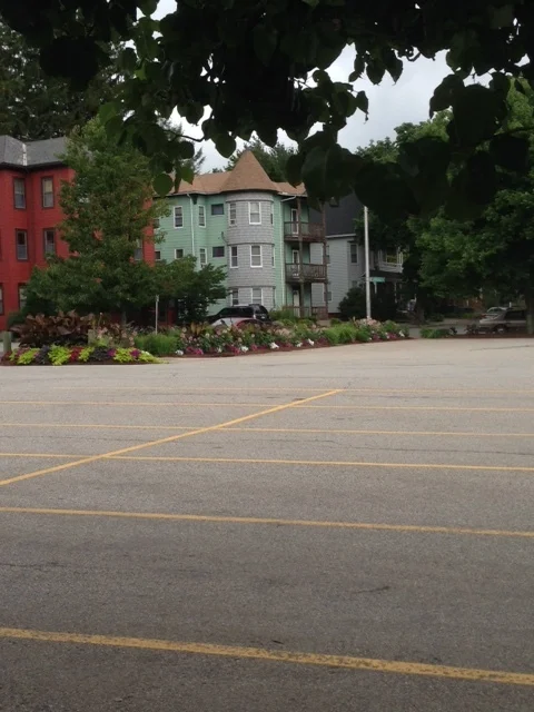 The parking lot seems to go on and on and on.... Once, this block was probably a mix of residential and commercial spaces, densely packed, bringing vitality to the street. This important density was razed to build this parking lot. Now, we have asphalt and temporary housing for cars. People drive here, park, eat their fish and then probably leave, detracting from the vitality of this neighborhood. The Sole is closed now and consequently, this whole city block is essentially dead. Also, please note that you will see this pattern over and over and over again. The front door to the Sole doesn't face Highland Street, does it? No, the Sole is closed to the main drag and fronts onto its huge parking lot. The expectation is clear: Diners will drive there, enter and then exit to their cars. We pointed out this model at the library and the YWCA as wel l.