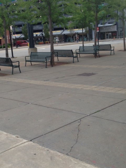 Even this pedestrian plaza on the last side of this block of a building is absolutely empty. Maybe I should come back at lunch time in an hour? Would the seats in this area possibly fill up during lunch? I'm a bit skeptical but maybe that happens. Oh and there is the garage in the background. We can just get back in our cars and drive away. Before or after the Sting concert, why would anyone walk around in this surrounding neighborhood anyway? It is probable that visitors come from out of town, park in the Major Taylor Municipal Lot, enter the building for the concert, exit and then leave. How does the DCU Center as a development project ever enhance the street life of our city? 