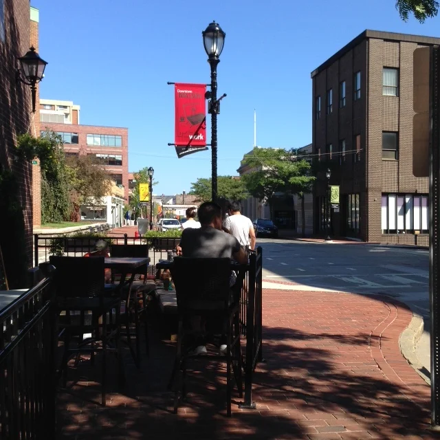 People hanging out in a cafe on Pleasant Street.