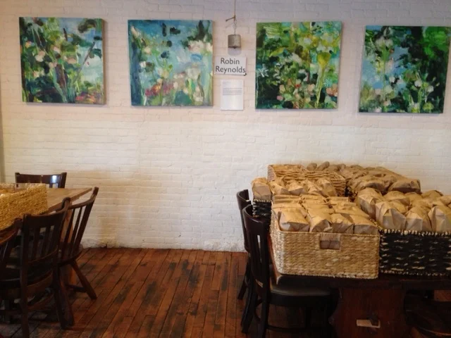 Gallery space for displaying the artwork of local artists. The bags of fresh bread that have just been baked will soon be sent to restaurants throughout the city.