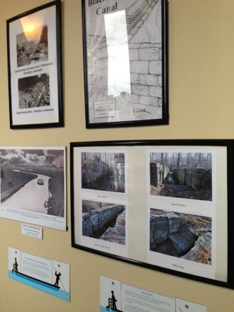 A curated exhibit along the length of the corridor walls leading to Birch Tree Bread Company explores the history of the Blackstone Canal and its link to Worcester's successful industrial past.