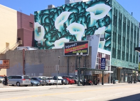 Downtown Oakland in a state of flux. Public art on old buildings is a sign or a symptom of current gentrification taking place.