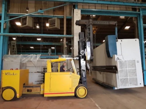 Loading a 27 tonne Press Brake by tandem lifting with overhead crane and versa lift