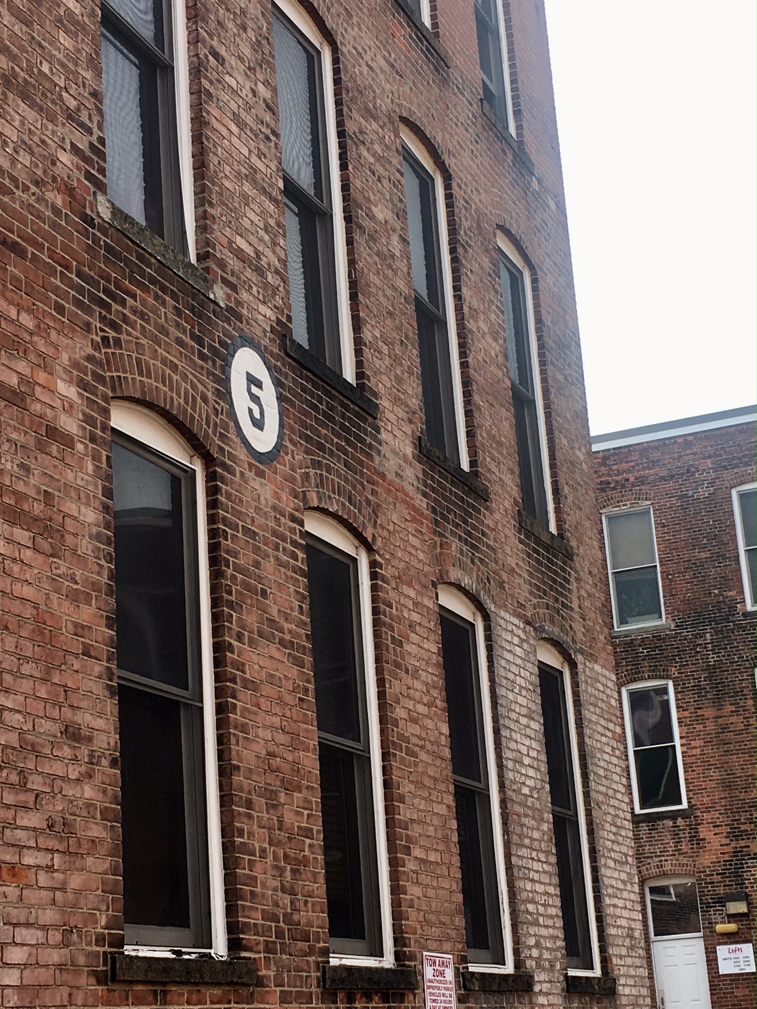 We live in a renovated corset factory. Yes, you read that right. And I love telling people that! The building numbers are my favorite.