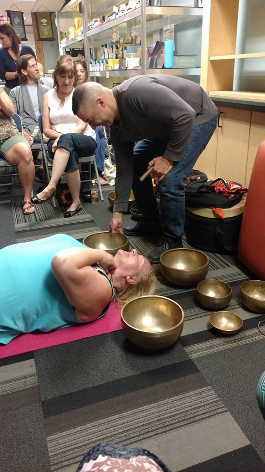  A very WILLING volunteer for a short demonstration on how a session of singing bowl therapy would happen.