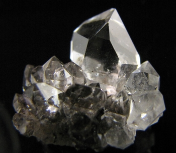 A rare cluster. Herkimer diamonds come out of the ground looking polished. They are clear, sometimes with a little sediment, and usually an air pocket.