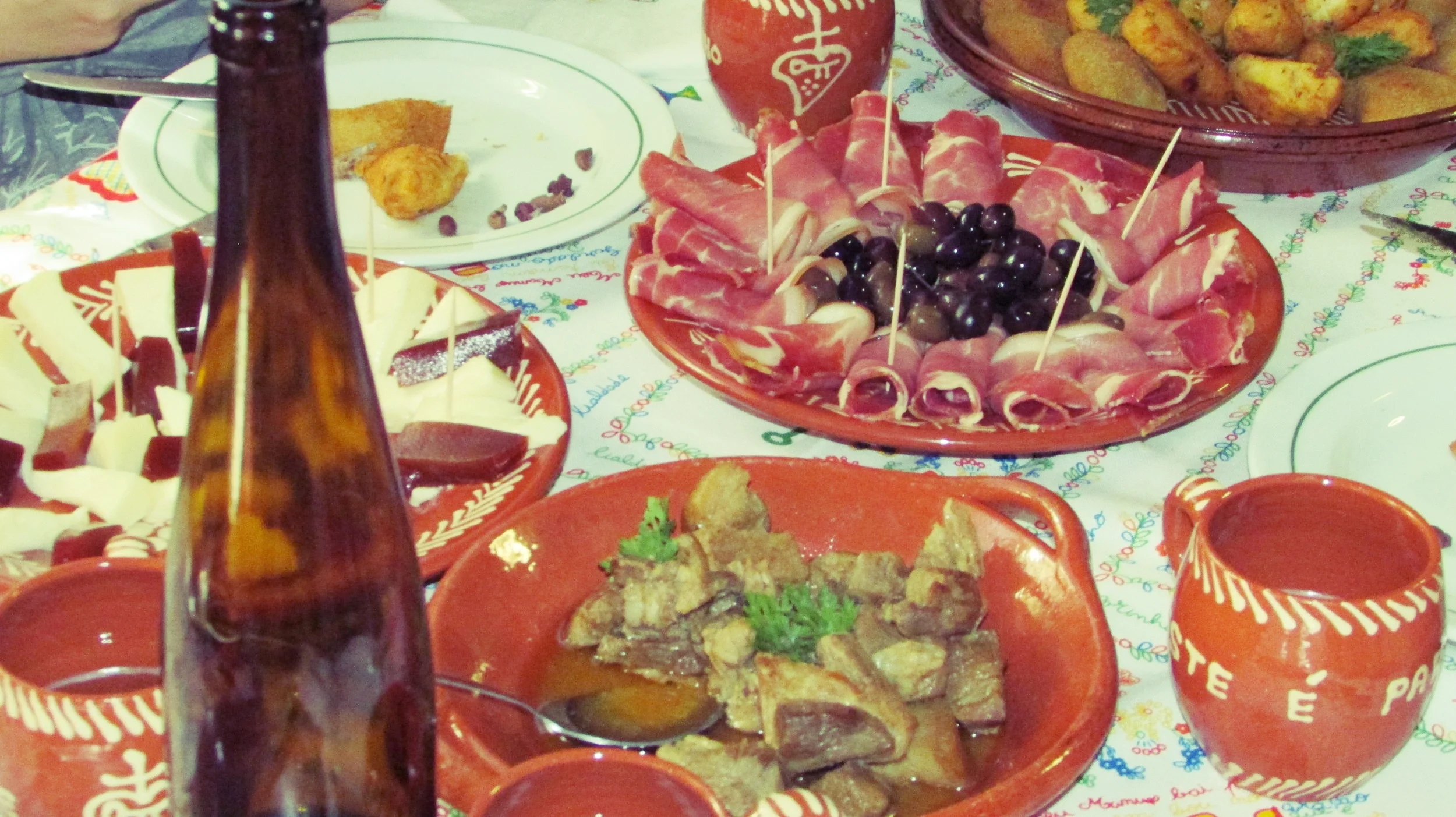 Green wine and home made food in a local house.