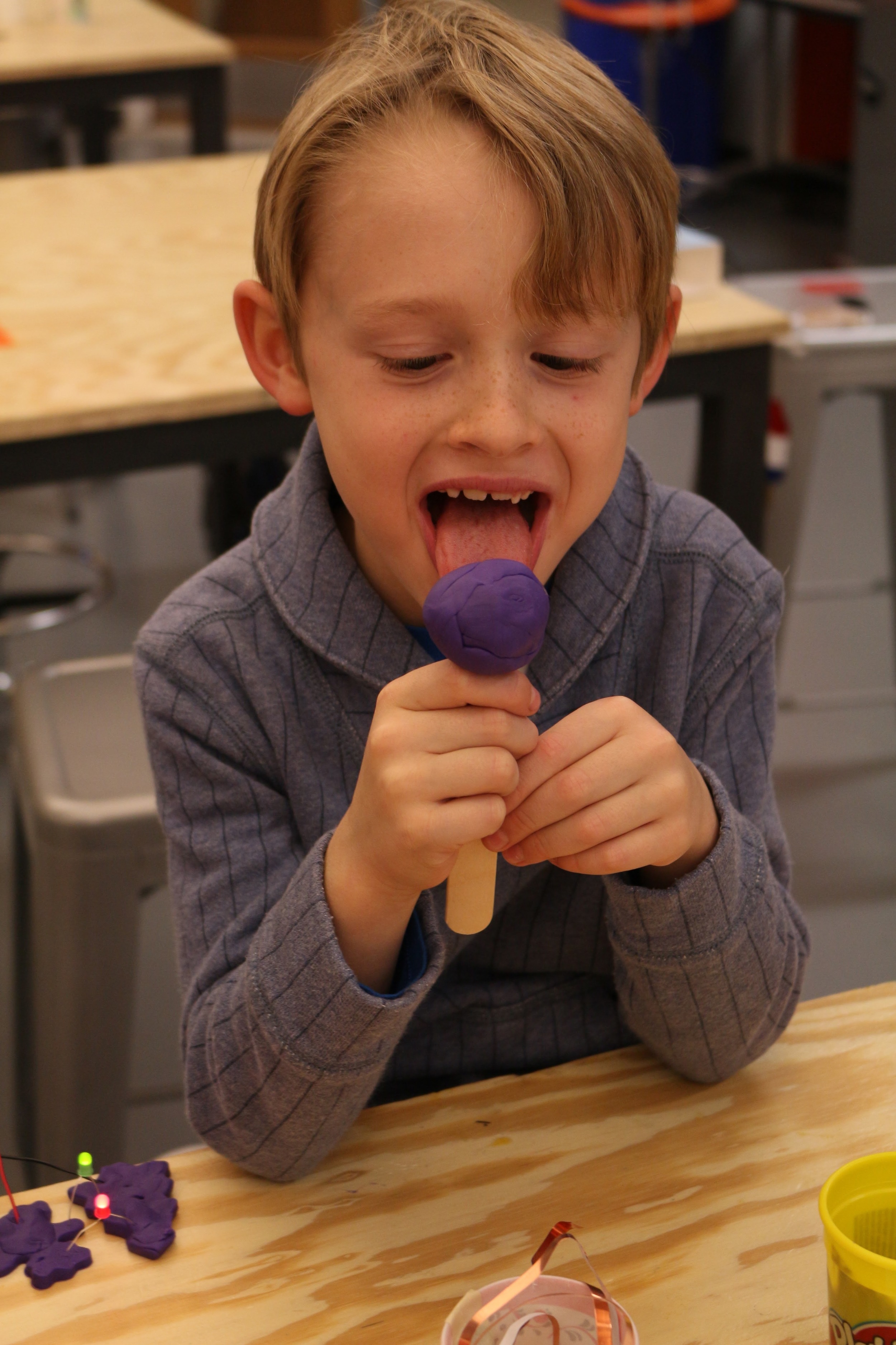 Charlie in the process of building a play-doh circuit.