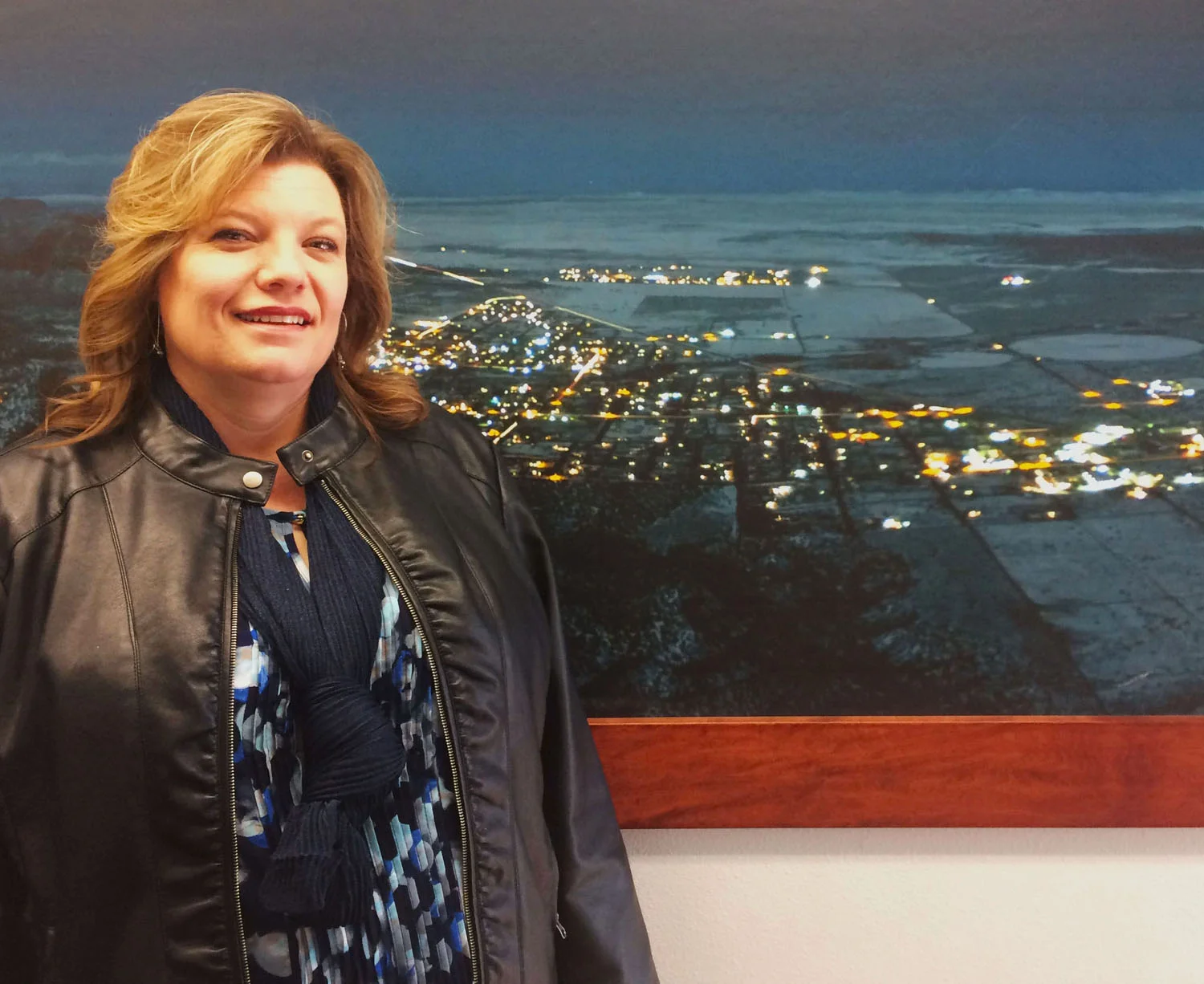 Donia Jessop, newly-elected mayor of Hildale, UT, in front of a photo depicting Short Creek.