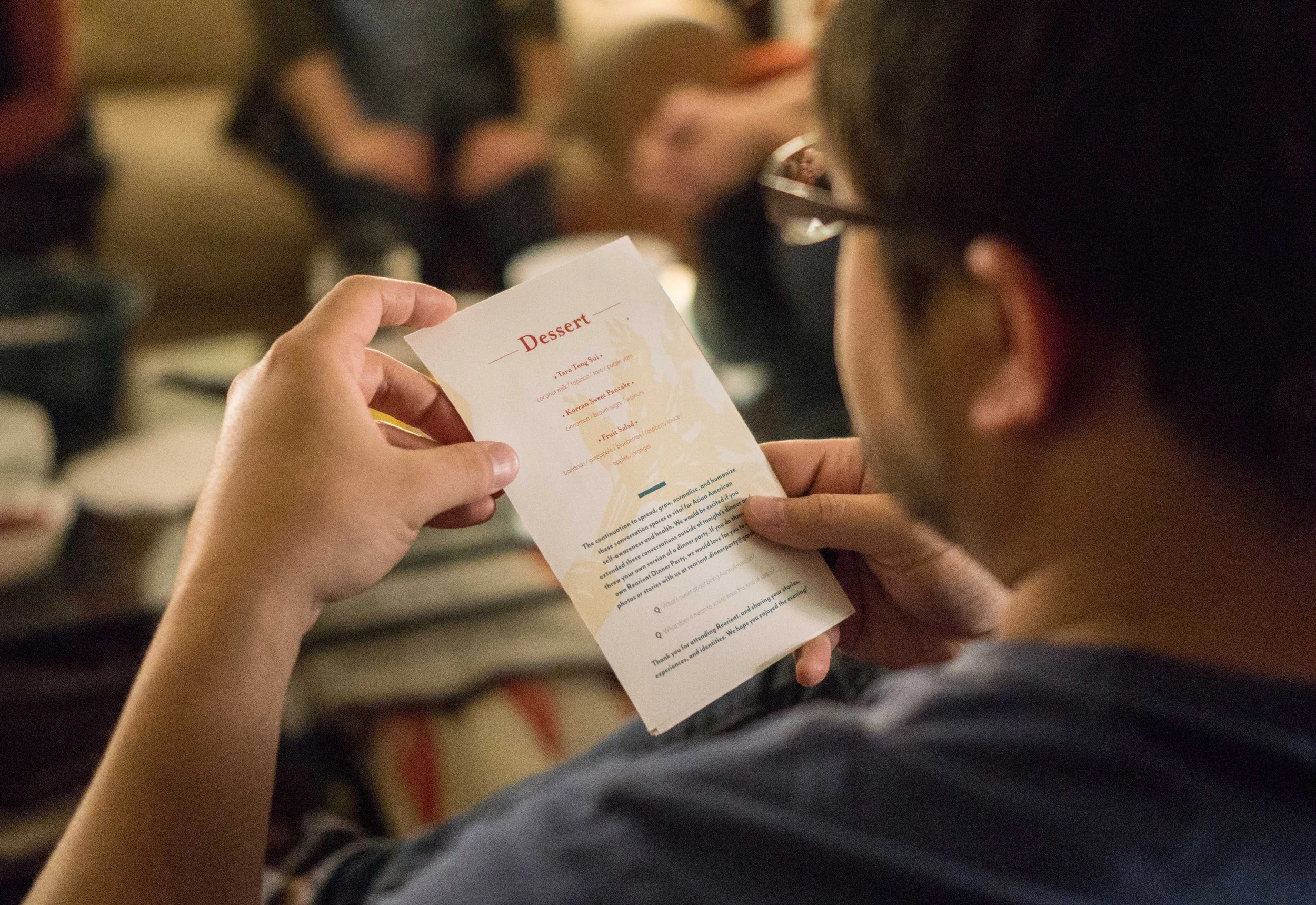 Paul Holding Menu crop.jpg