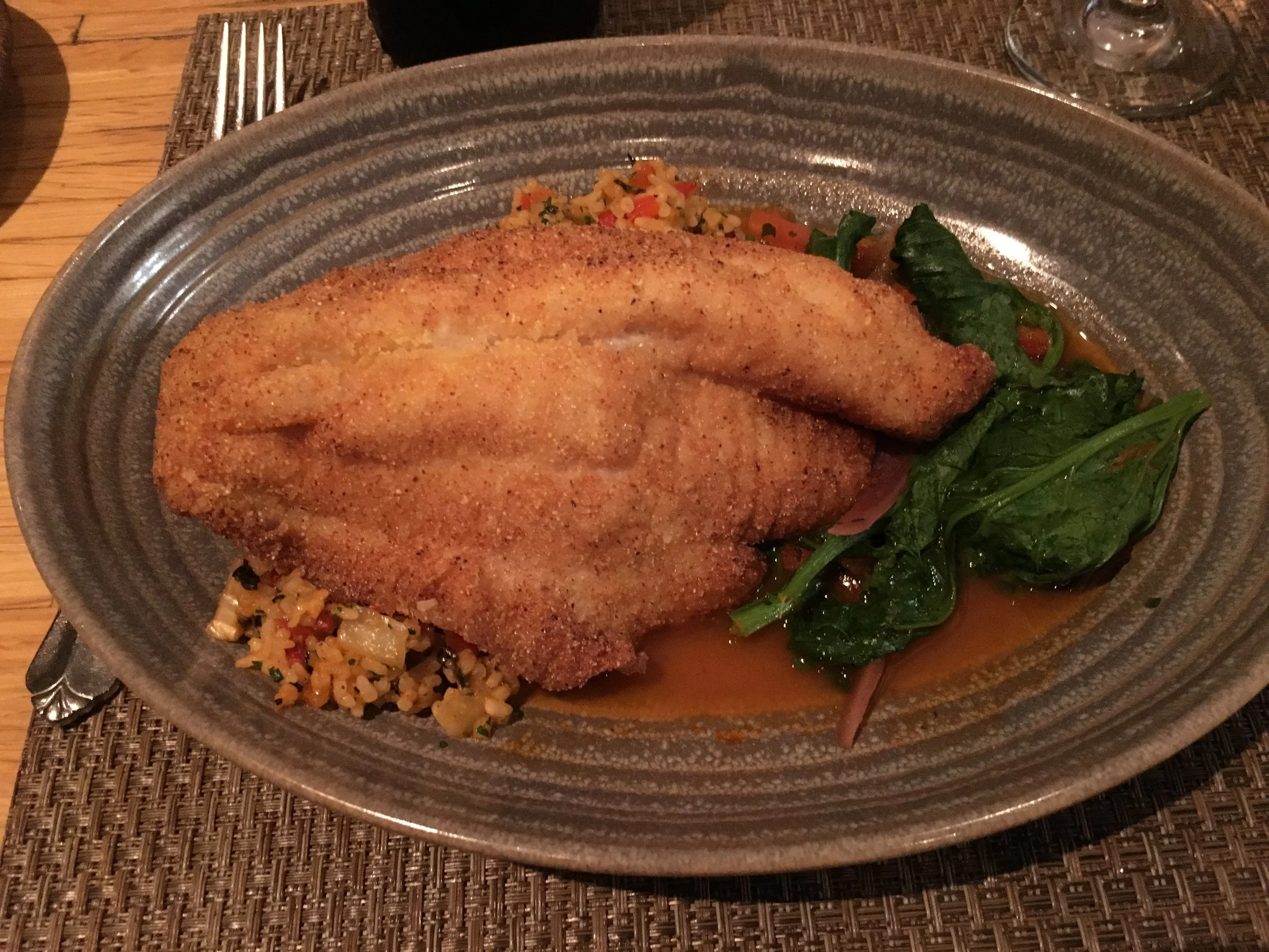 Catfish and Carolina gold rice with a side of rapini.