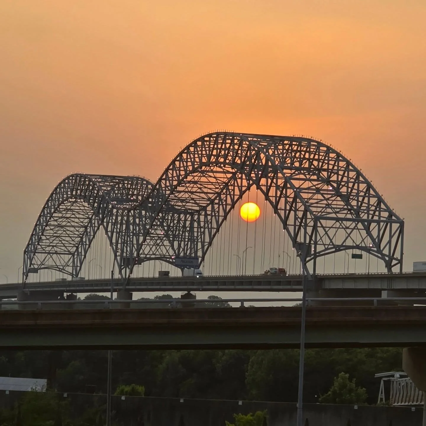 Pic 1 is my favorite shot of the Hernando de Soto Bridge in Memphis. Also called the "M" Bridge. 

We were in the car heading to another activity, but this moment HAD TO be captured. 📸

Pics 2 and 3 are views from our hotel window. MUST ha