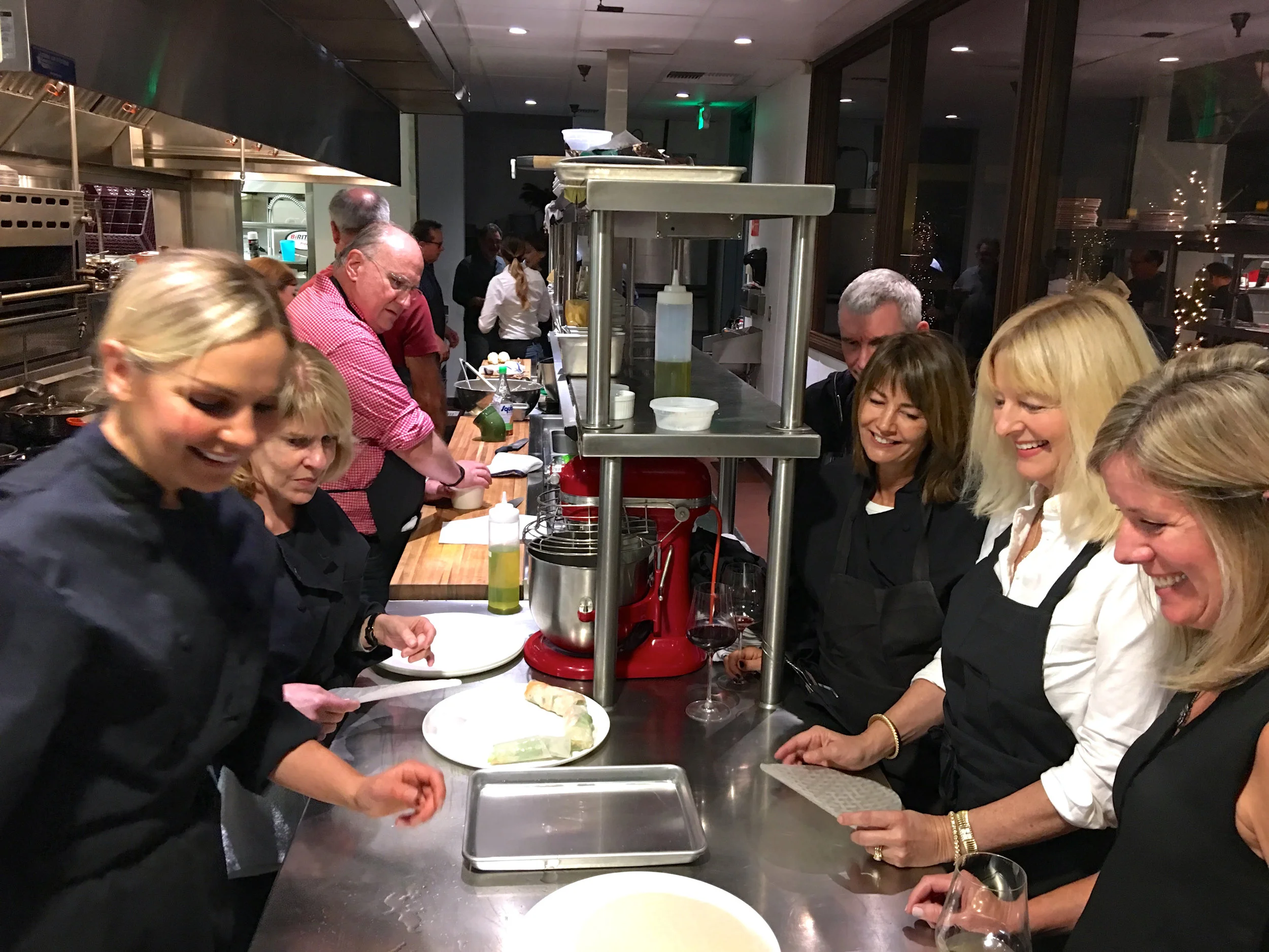 Members and staff whipping up an Asian feast together ( Photo: Mike Casey, The 29 Napa )