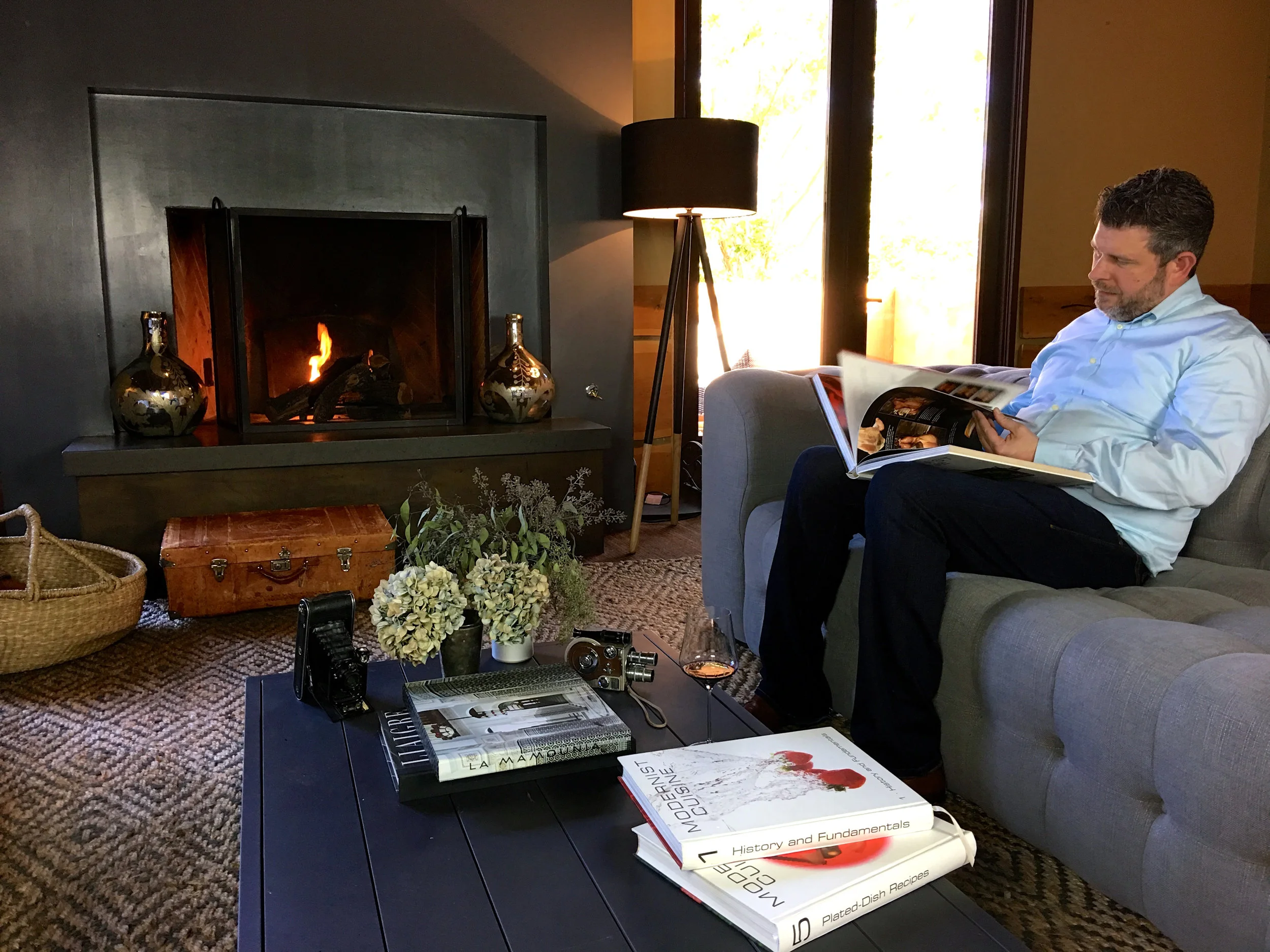 Garret getting recipe inspirations from some of his classic cookbooks ( Photo: Mike Casey, The 29 Napa )