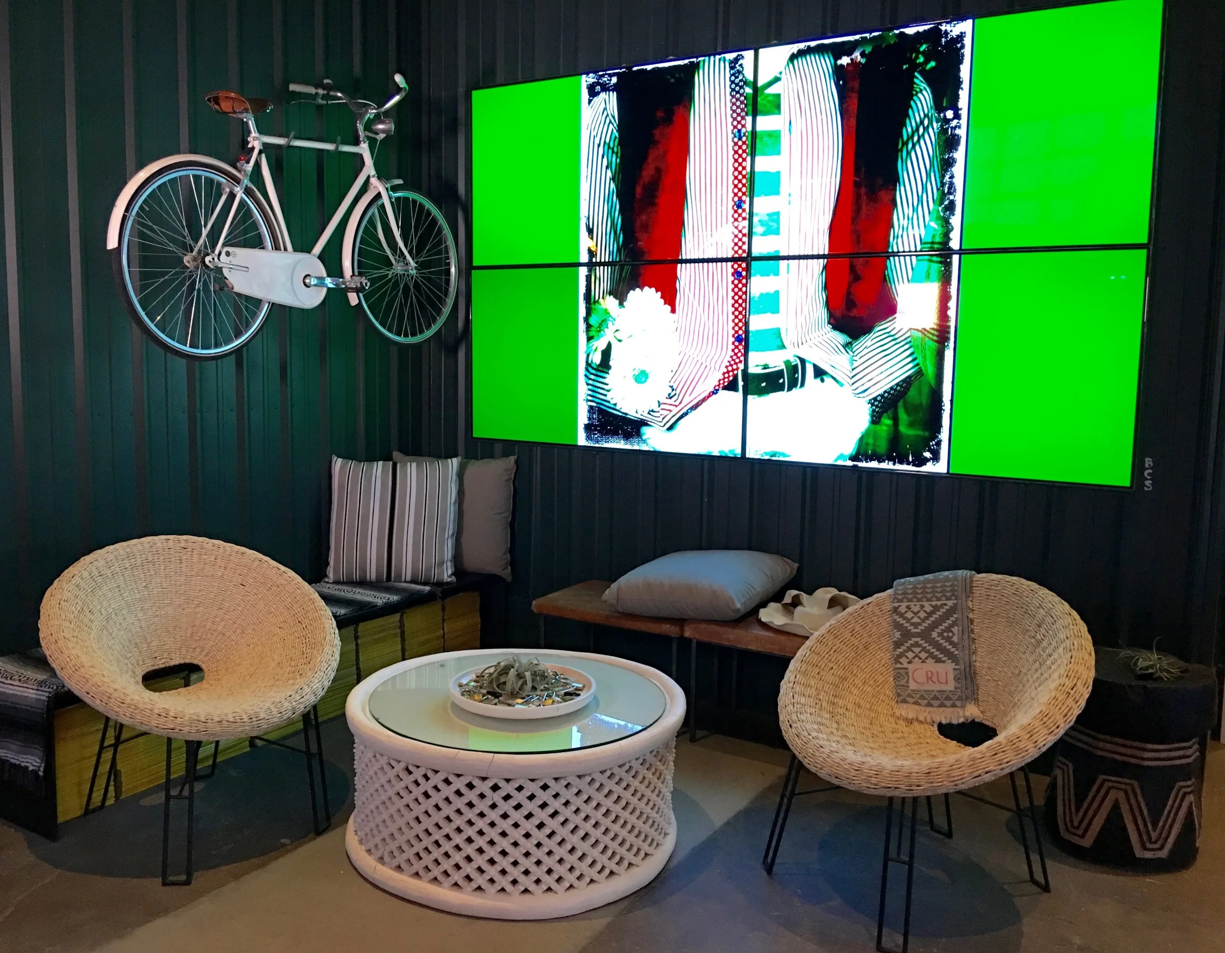 Deep green walls add to the pop of the brilliant video wall ( Photo: Mike Casey, The 29 Napa )