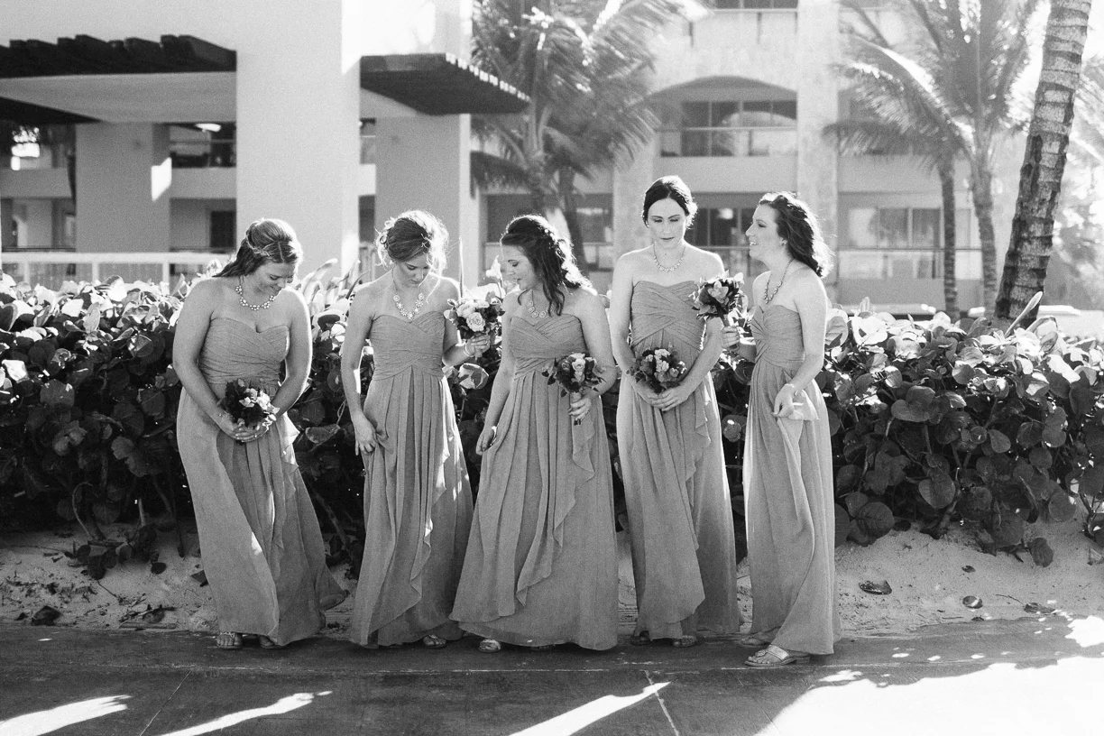 Punta Cana destination wedding, bridesmaids pause for a quiet moment before their friends' ceremony