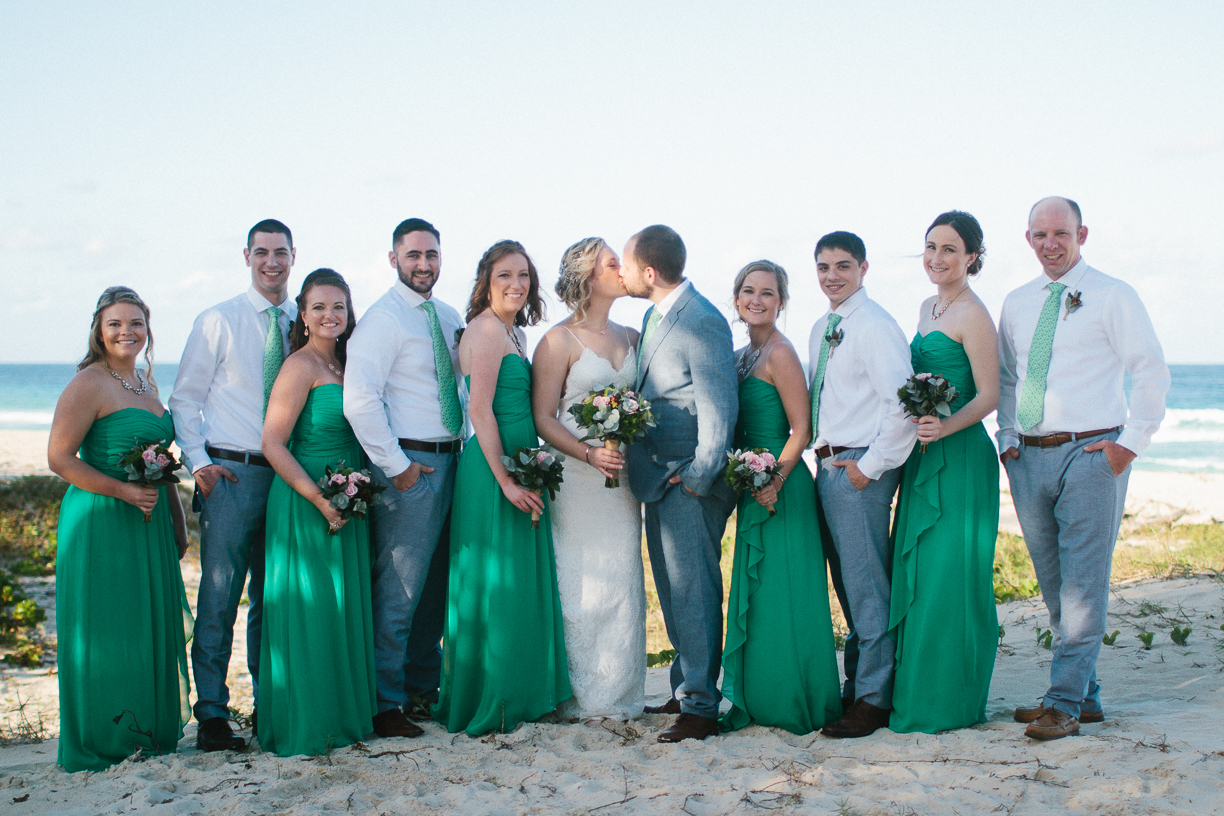 Punta Cana destination wedding, beach front wedding ceremony at sunset, bridal party