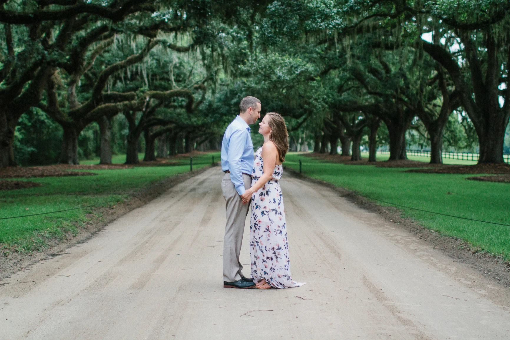 Engaged couple smiling at Boone Hall Plantation, Charleston South Carolina by Danielle Gallo Photography