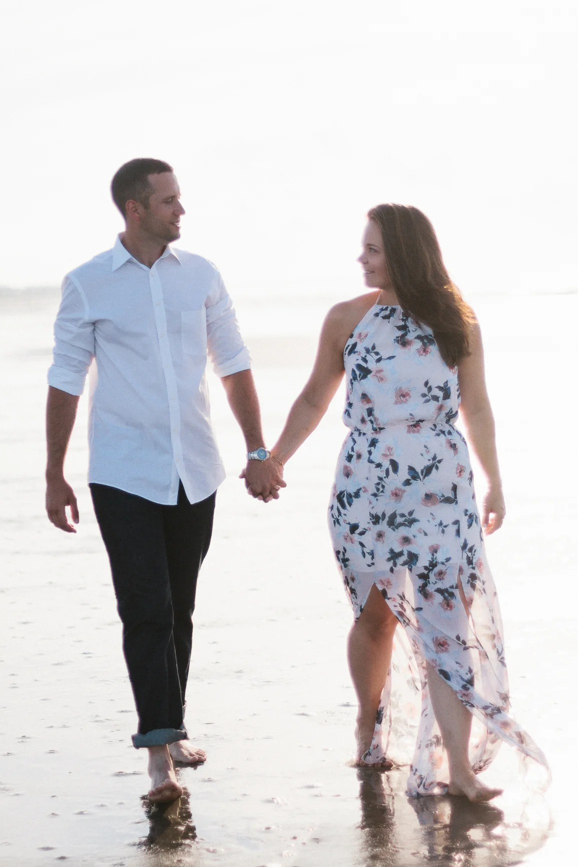 Engaged couple walking on the beach at Kiawah Island Beach Resort, Kiawah Island South Carolina by Danielle Gallo Photography