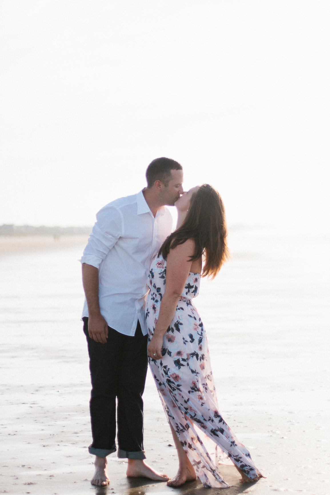 Engaged couple kissing on the beach at Kiawah Island Beach Resort, Kiawah Island South Carolina by Danielle Gallo Photography